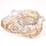 A LATE 19TH CENTURY GILT GLASS HORS D'OEUVRE DISH with scrolling handles (unmarked), 20cm across
