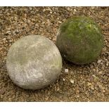 TWO OLD CARVED LIMESTONE SPHERES OR FINIALS each approximately 28cm diameter