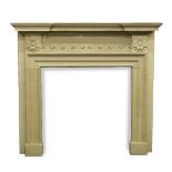 A PALLADIAN STYLE CARVED LIMESTONE CHIMNEY PIECE with breakfront moulded mantle, protrusion scroll