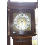 A LONGCASE CLOCK the 19th Century brass and silvered dial with Roman numerals, signed Thomas