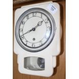 A SMITHS WHITE PAINTED WALL HANGING KITCHEN CLOCK in the art deco style, 18cm wide x 26cm high