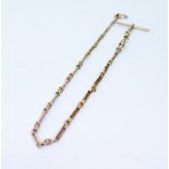 A 15CT YELLOW GOLD LADIES WATCH CHAIN marked '15', 26cm overall weighs 28 grams approximately