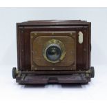 A 19TH CENTURY MAHOGANY PLATE CAMERA with label for J.H. Dallmeyer, Optician, London 23.5cm wide x