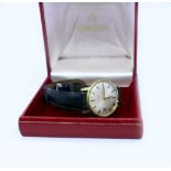 A 1970'S OMEGA GENT'S WRIST WATCH in gilt case with leather strap, in associated box