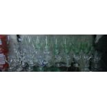 A COLLECTION OF GREEN TINTED EARLY TO MID 20TH CENTURY DRINKING GLASSES of various quantities and