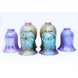 THREE PAIRS OF IRIDESCENT GLASS LIGHT SHADES and five bronzed metal fittings