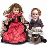 TWO ARMAND MARSEILLE BISQUE HEADED DOLLS of similar size with stamped marks to the back of the