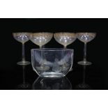 A SET OF SIX MID TO LATE 20TH CENTURY CHAMPAGNE FLUTES with gilded decoration and hollow stems, each