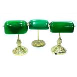 A GROUP OF THREE BRASS GREEN GLASS SHADED DESK LAMPS on turned bases 36cm high (3)