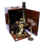 A LATE 19TH / EARLY 20TH CENTURY BRASS LACQUERED MICROSCOPE unsigned, with additional apparatus