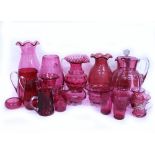 A COLLECTION OF CRANBERRY GLASSWARE to include vases, jugs, dishes etc., the largest vase 26.5cm