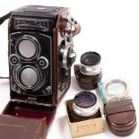 A ROLLEIFLEX GERMAN FILM CAMERA in original leather case, number 8428342, with additional dials