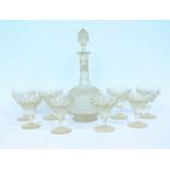 A 19TH CENTURY CUT GLASS DECANTER and eight cut wine glasses (9)