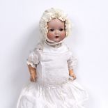 AN ANTIQUE ARMAND MARSEILLE BISQUE HEADED DOLL the back of the head stamped 518/3K, 39cm high