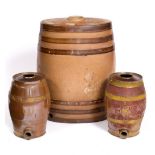 A J.STIFF LAMBETH STONEWARE BARREL 44cm wide x 62cm high and two smaller stoneware spirit barrels,