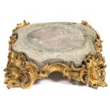 A 19TH CENTURY ORMOLU AND COMPOSITE STONE STAND with scrolling acanthus leaf and grape vine