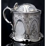 A MID VICTORIAN SILVER TANKARD MUSTARD, the sides with hexagonal flattened panels and engraved