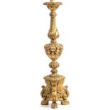 A GILT TABLE LAMP with moulded acanthus leaf and fruit decoration and within a triform base