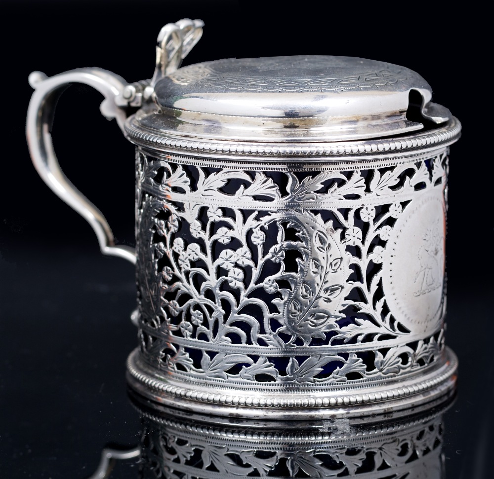 A MID VICTORIAN SILVER DRUM MUSTARD, the sides pierce decorated and engraved with stylized flowering