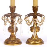 A PAIR OF CAST GILT METAL TABLE LAMPS of classical decoration with hanging drops, 30cm high