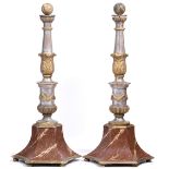 A PAIR OF GILT PAINTED HARDWOOD TORCHERES with scrolling acanthus decoration on marble effect bases,