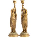 A PAIR OF EARLY 20TH CENTURY ORMOLU TABLE LAMPS in the form of classical maidens holding torcheres