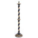 AN EBONISED AND PARCEL GILT LAMP STANDARD with barley twist column and circular spreading base,