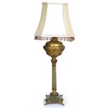 AN ONYX TABLE LAMP with gilt metal mounts, the lamp with classical column support on a stepped base,