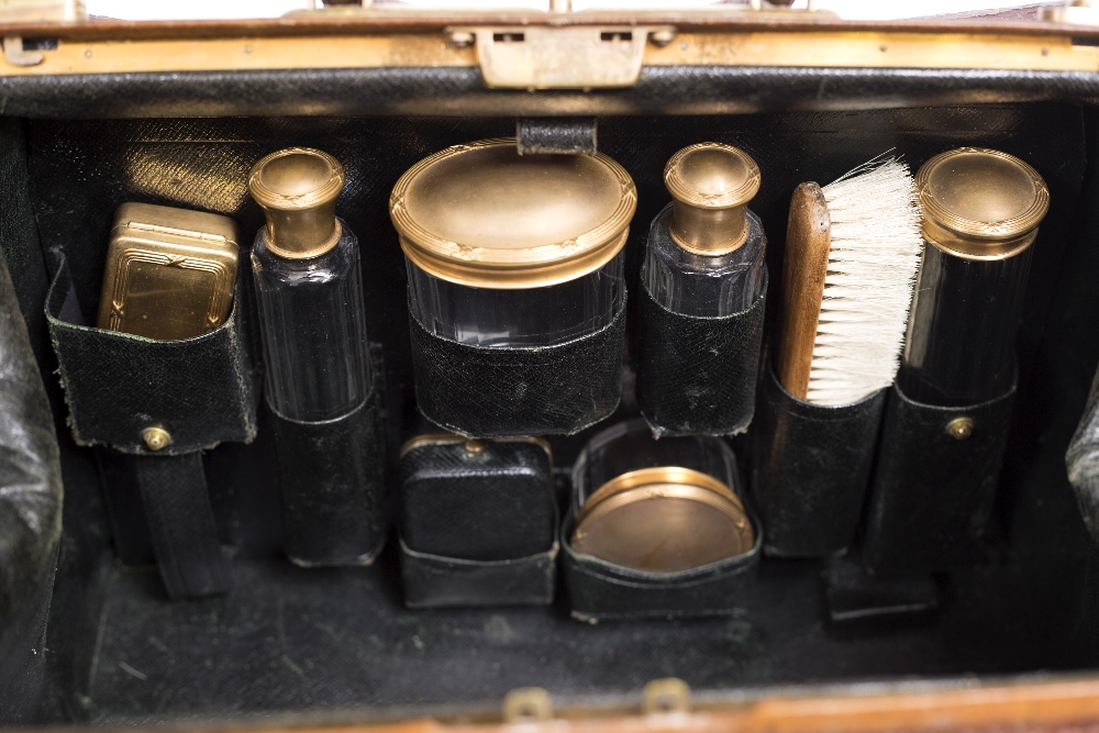 A LATE 19TH / EARLY 20TH CENTURY LEATHER GLADSTONE BAG with fitted interior and accessories to - Image 2 of 2