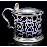AN EARLY VICTORIAN SILVER DRUM MUSTARD, the sides pierce decorated with stylized scrollwork, the
