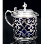A MID VICTORIAN SILVER TANKARD MUSTARD, with pierce decorated sides and engraved cover, blue glass