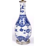 AN 18TH CENTURY CHINESE FLOWER DECORATED BOTTLE VASE later drilled for use as a table lamp, 34.5cm