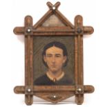 AN ANTIQUE AMERICAN PRIMITIVE HEAD AND SHOULDER PORTRAIT oil on canvas, 28cm x 23cm, mounted in a