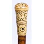 A LATE 17TH CENTURY MALACCA WALKING CANE with turned ivory handle with piquet work decoration 91cm