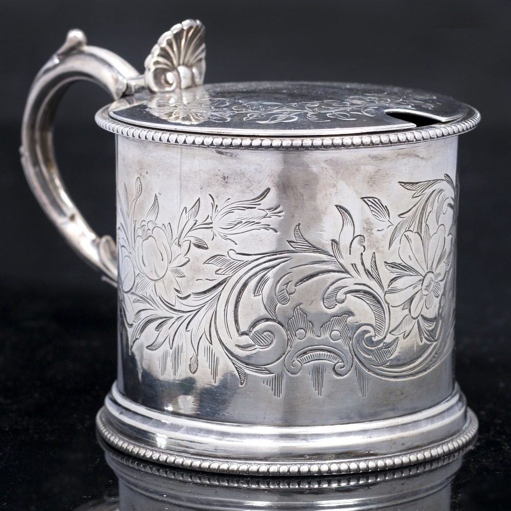 A MID VICTORIAN SILVER DRUM MUSTARD, engraved with scrolling foliage and with beaded borders,