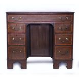 A GEORGE III STYLE MAHOGANY KNEEHOLE DESK 89cm wide x 44cm deep x 75.5cm high