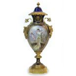 A CONTINENTAL PORCELAIN VASE AND COVER with ormolu mounts in the form of a fawn masks, the painted