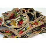 A COLLECTION OF NEEDLEPOINT OR TAPESTRY GARLANDS OR PELMETS of varying lengths, the longest measures