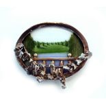 A MODERN SILVER BROOCH of oval form with inset enamel panel with a far reaching pastoral view,