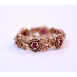 A 9CT ROSE GOLD PINK STONE RING with leaf decoration, size 'T', overall weight 6.8 grams
