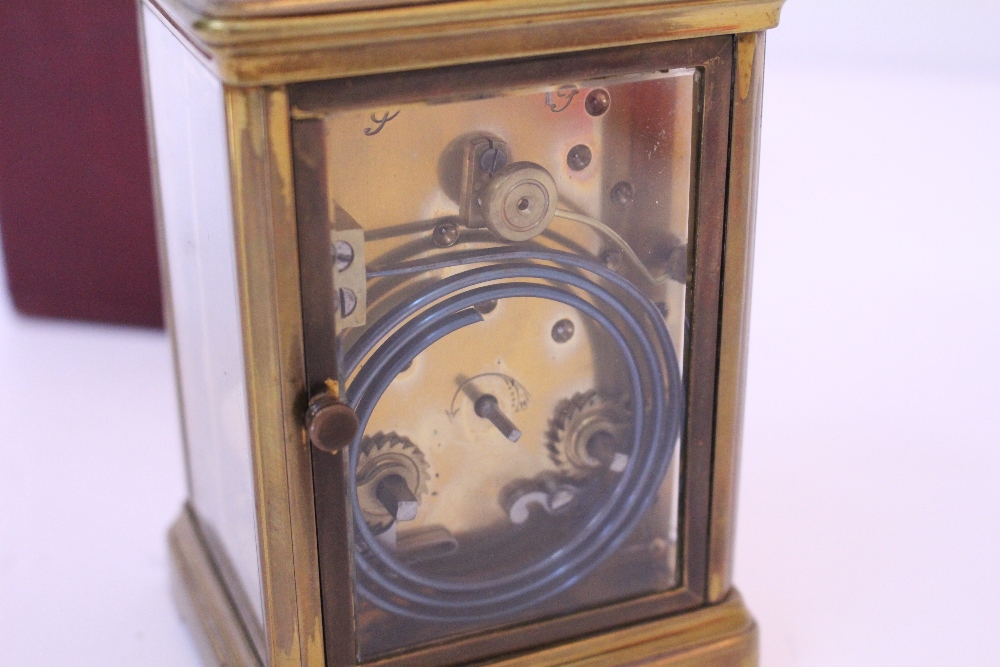 AN EARLY 20TH CENTURY BRASS CASED CARRIAGE CLOCK with white enamel dial and black Arabic numerals, - Image 3 of 5
