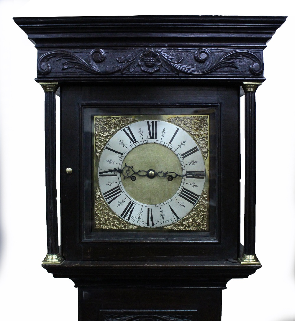 AN OLD EIGHT DAY LONG CASE CLOCK with chip carved decoration to the case, and with brass dial with - Image 2 of 2