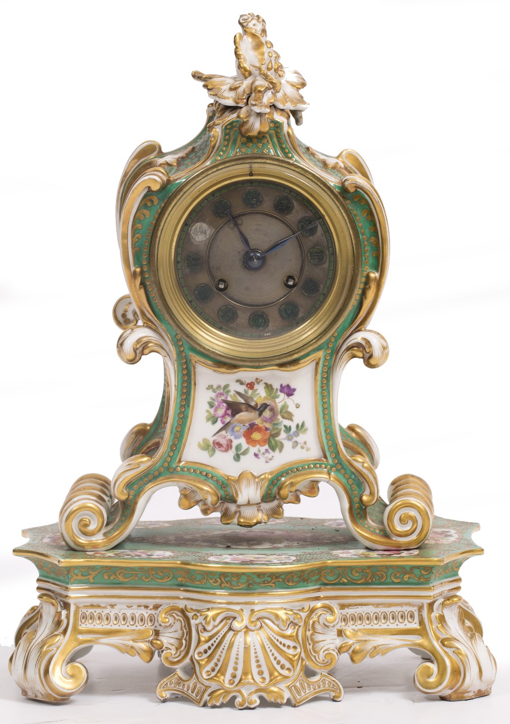 A 19TH CENTURY CONTINENTAL PORCELAIN MANTLE CLOCK the green ground case with scroll decoration and