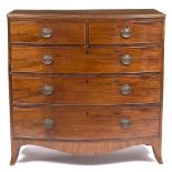 A GEORGE III MAHOGANY BOW FRONTED CHEST OF TWO SHORT AND THREE LONG DRAWERS with oval brass