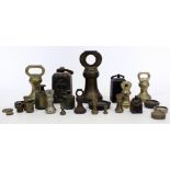 A COLLECTION OF VARIOUS BRASS AND IRON SCALE WEIGHTS to include various bell weights, the largest