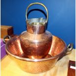 A 20TH CENTURY COPPER JAM PAN with twin wrought iron handles and a copper jug with beaten effect