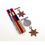 THREE WORLD WAR II MEDALS to include Service Medal, Italy Star and one other (3)