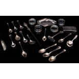 A QUANTITY OF SILVER to include two pairs of serviette rings, six tea spoons, a visiting card