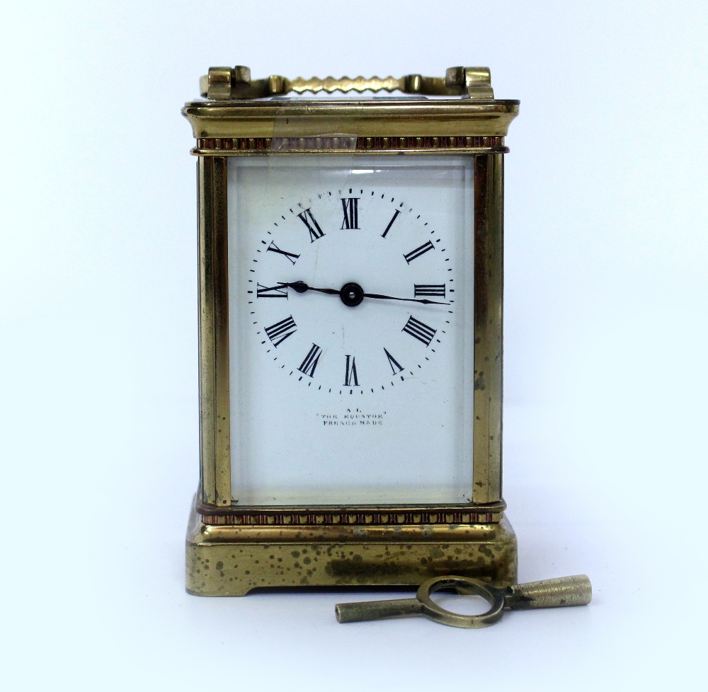 A LATE 19TH / EARLY 20TH CENTURY FRENCH BRASS CARRIAGE CLOCK with white enamel dial marked 'The