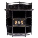 A VICTORIAN AESTHETIC STYLE EBONISED FLOOR STANDING CORNER CABINET with raised galleried back and